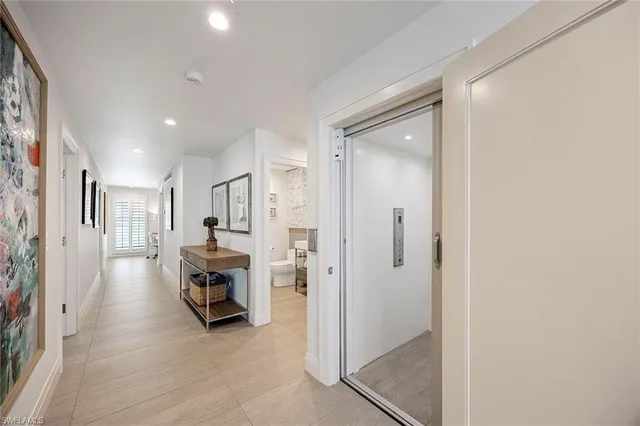 a view of utility room and front door
