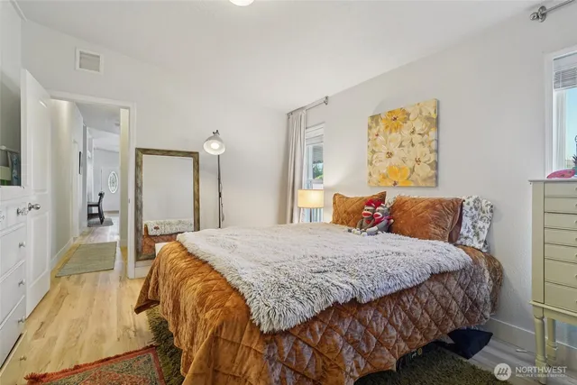 a bedroom with a bed and a couch