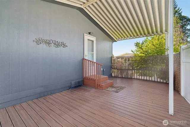 a view of a backyard with wooden floor