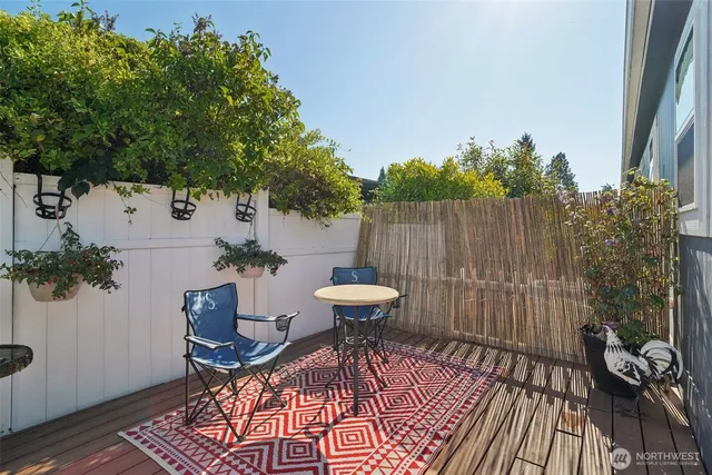 a backyard of a house with outdoor seating