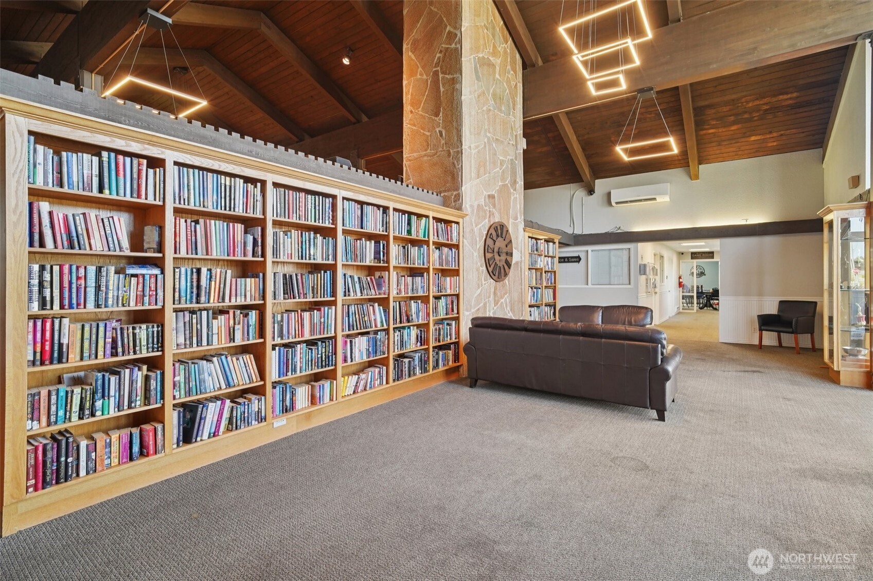 2101 South 324th Street, Unit 166 Federal Way, WA 98003 - Photo 24 of 33 a living room with lots of furniture and a book shelf