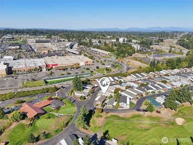 a view of a house with yard and a garden