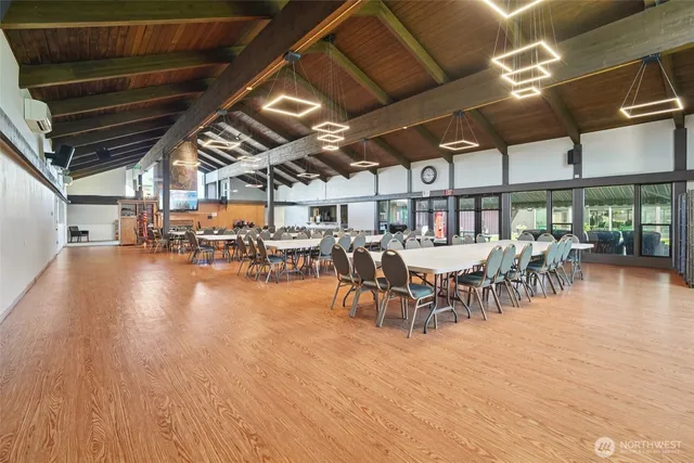 a living room with lots of furniture and a book shelf