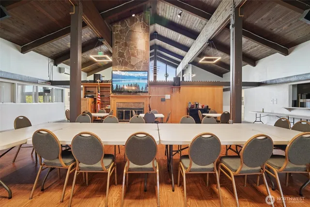 a dinning room with furniture a window and a table