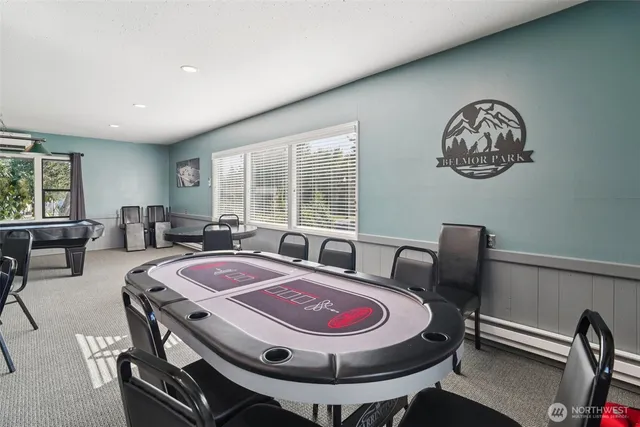 a living room with furniture a window and a table