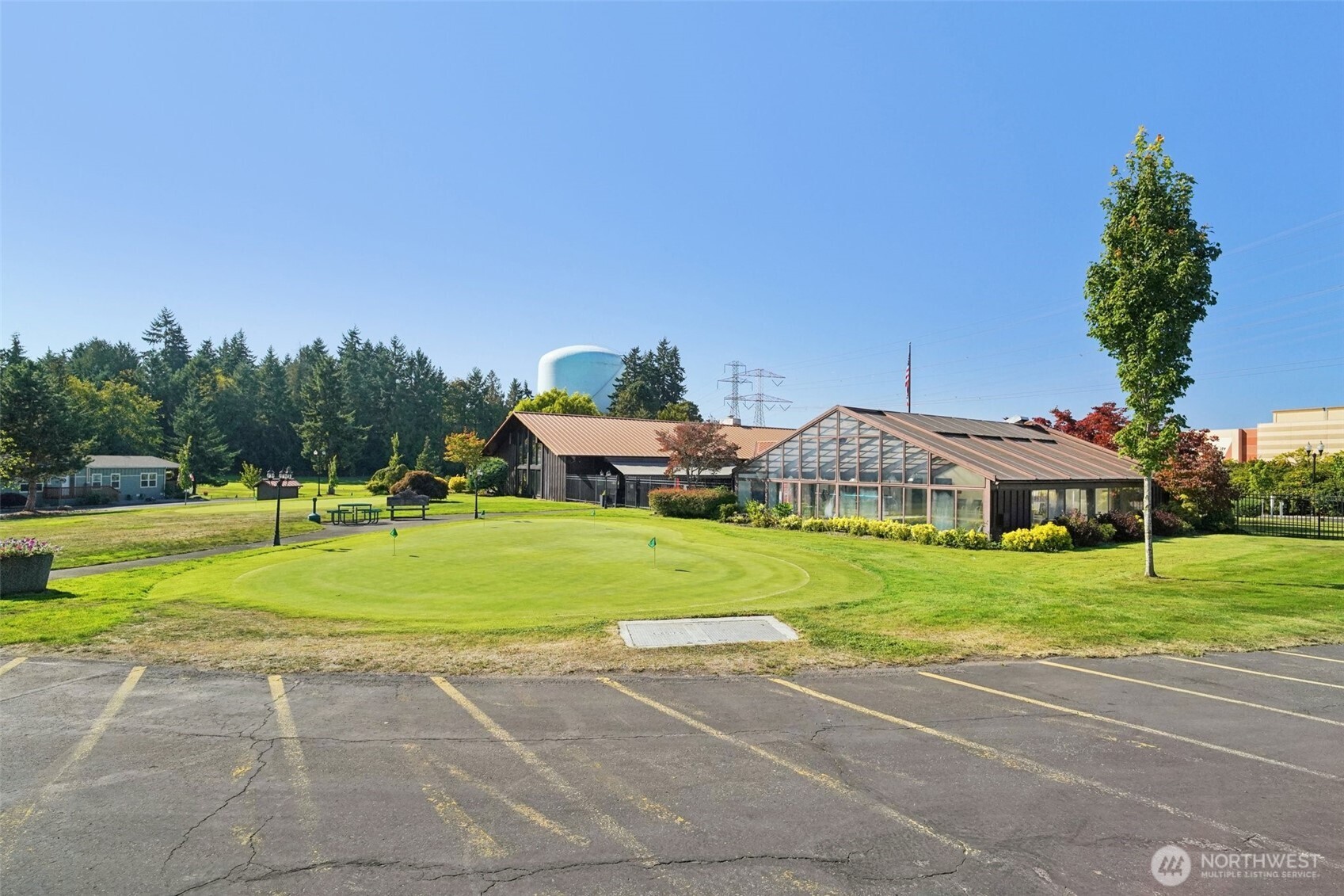 2101 South 324th Street, Unit 166 Federal Way, WA 98003 - Photo 32 of 33 a front view of a house with a yard and trees