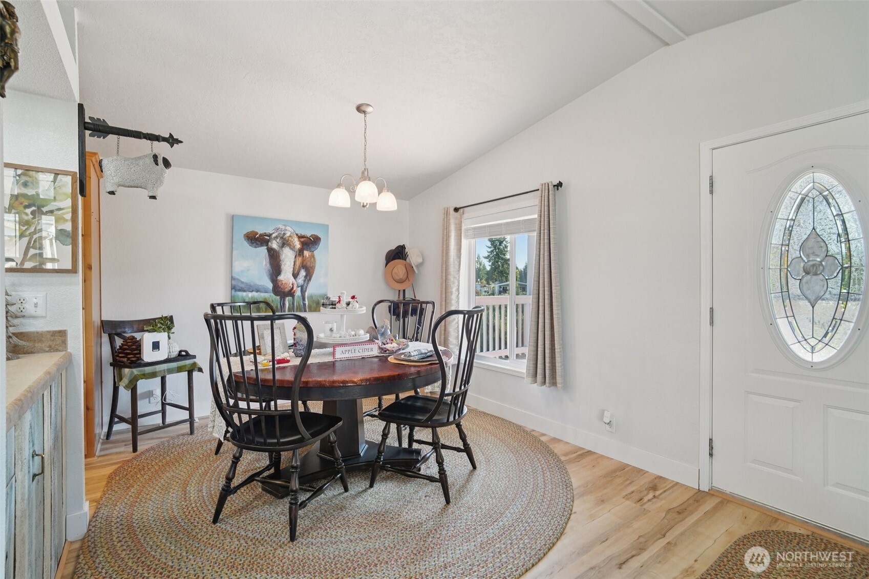 2101 South 324th Street, Unit 166 Federal Way, WA 98003 - Photo 6 of 33 a view of a dining room with furniture window and wooden floor