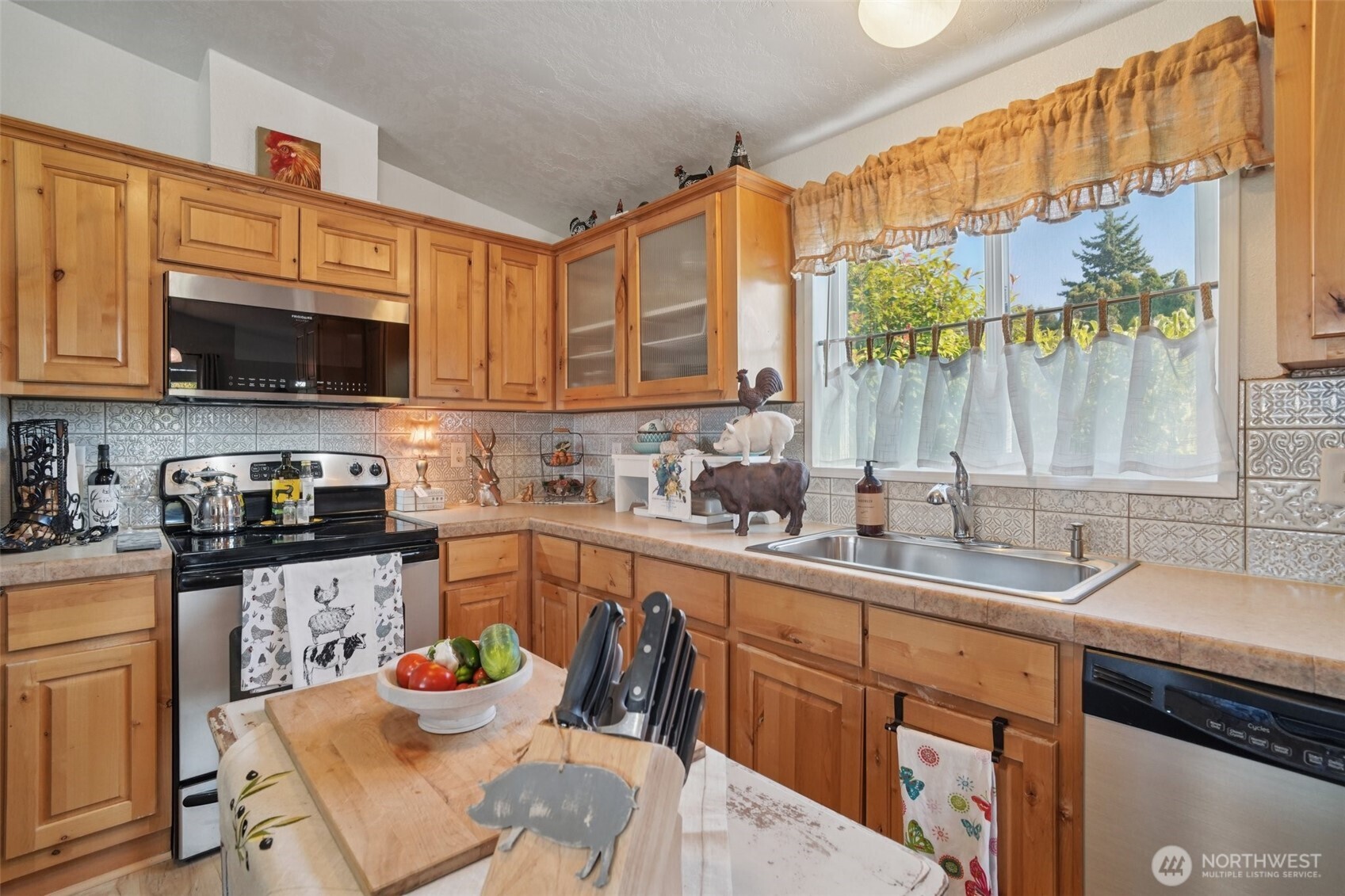 2101 South 324th Street, Unit 166 Federal Way, WA 98003 - Photo 9 of 33 a kitchen with granite countertop a sink a counter top space appliances and cabinets