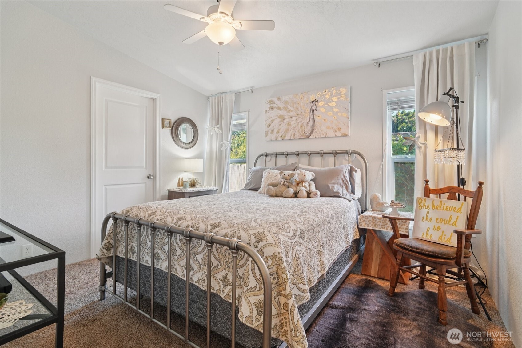 2101 South 324th Street, Unit 166 Federal Way, WA 98003 - Photo 10 of 33 a bedroom with a bed and a chandelier