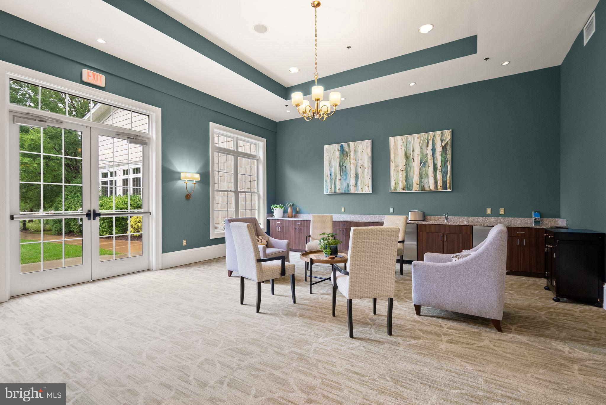 20610 Hope Spring Terrace, Unit 104 Ashburn, VA 20147 - Photo 29 of 38 Inviting lounge with serene decor.