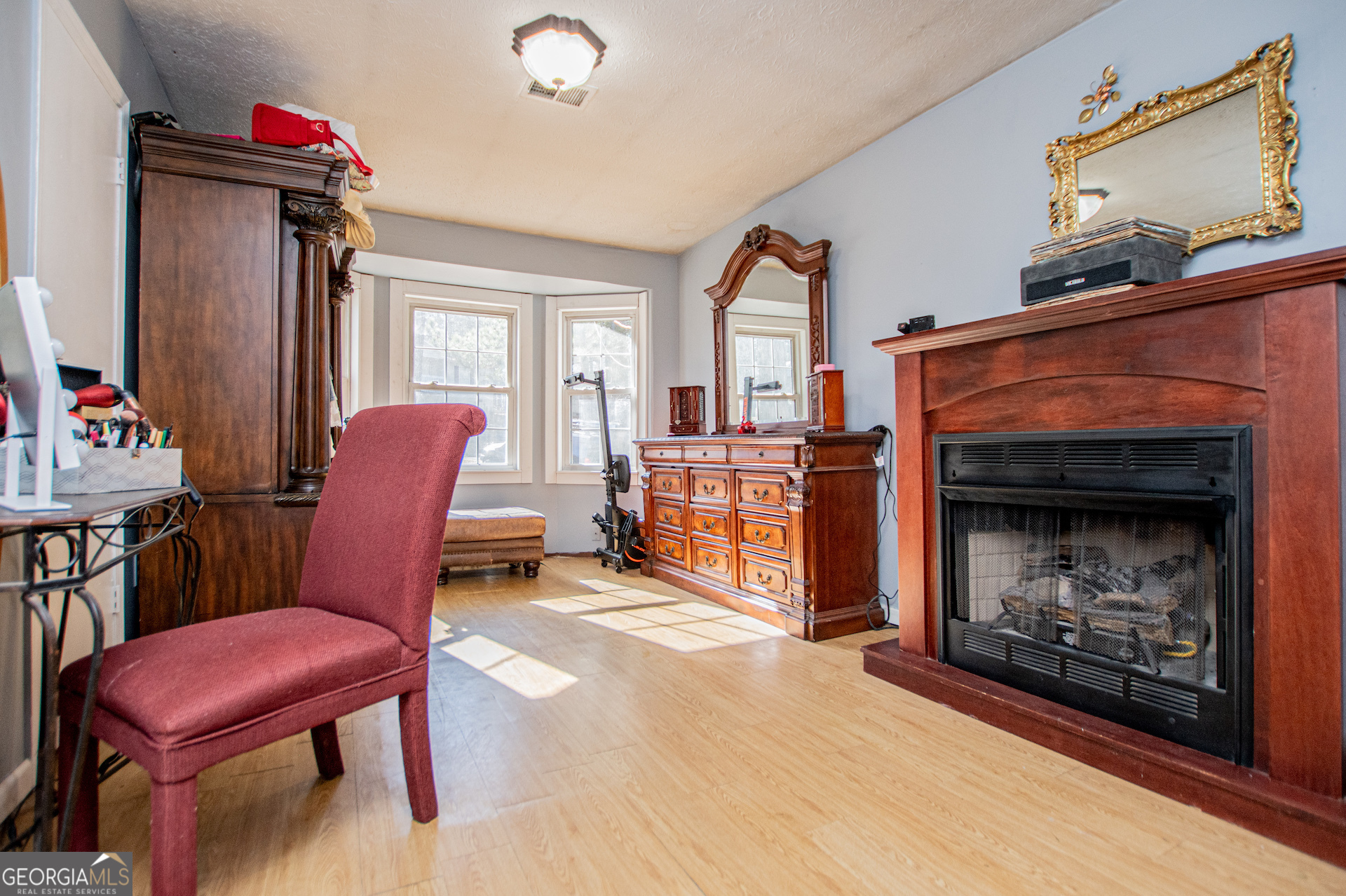 162 Parkway Circle Villa Rica, GA 30180 - Photo 15 of 35 a living room with furniture and a fireplace