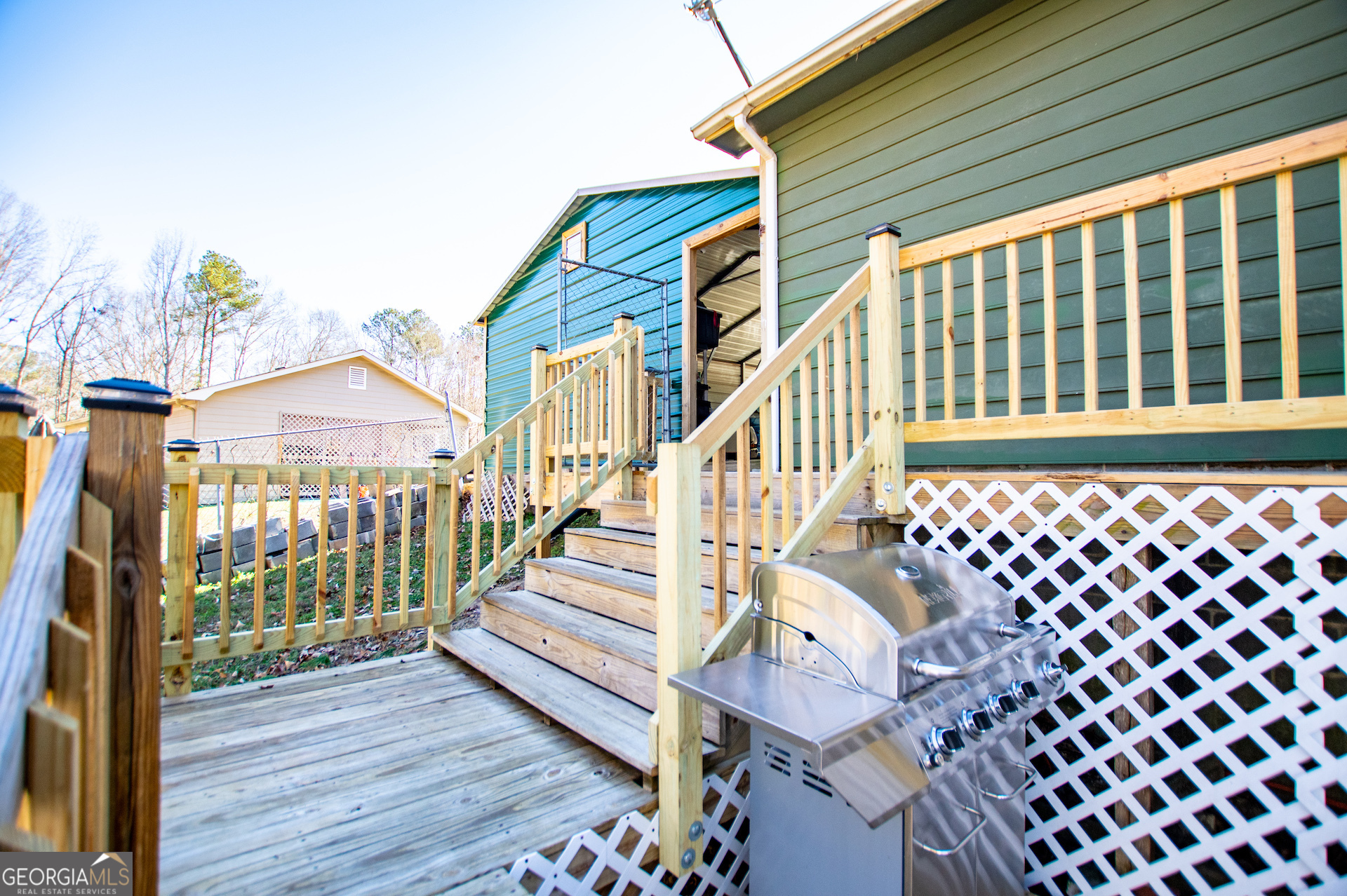 162 Parkway Circle Villa Rica, GA 30180 - Photo 21 of 35 a view of a brick house with wooden fence