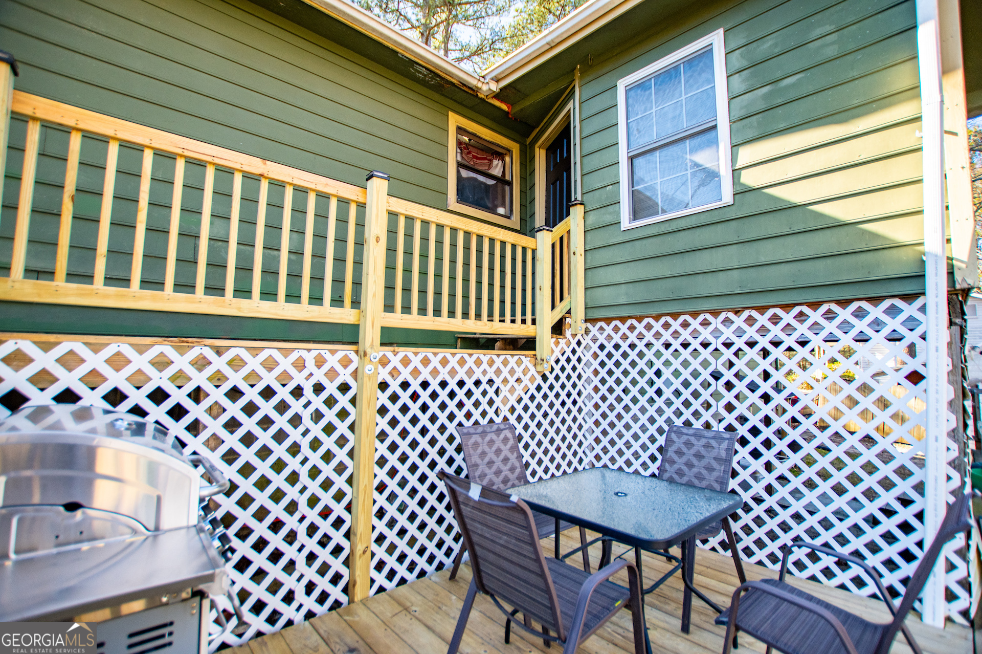 162 Parkway Circle Villa Rica, GA 30180 - Photo 23 of 35 a view of a chair and table in the back yard