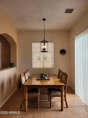 a dining room with furniture and window