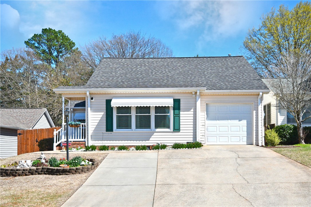 This charming residence features a well-maintained exterior and inviting curb appeal.