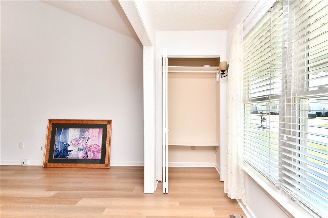 103 Baldwin Place Easley, SC 29642 - Photo 13 of 42 Bright interior space features a closet with folding doors and a large window.