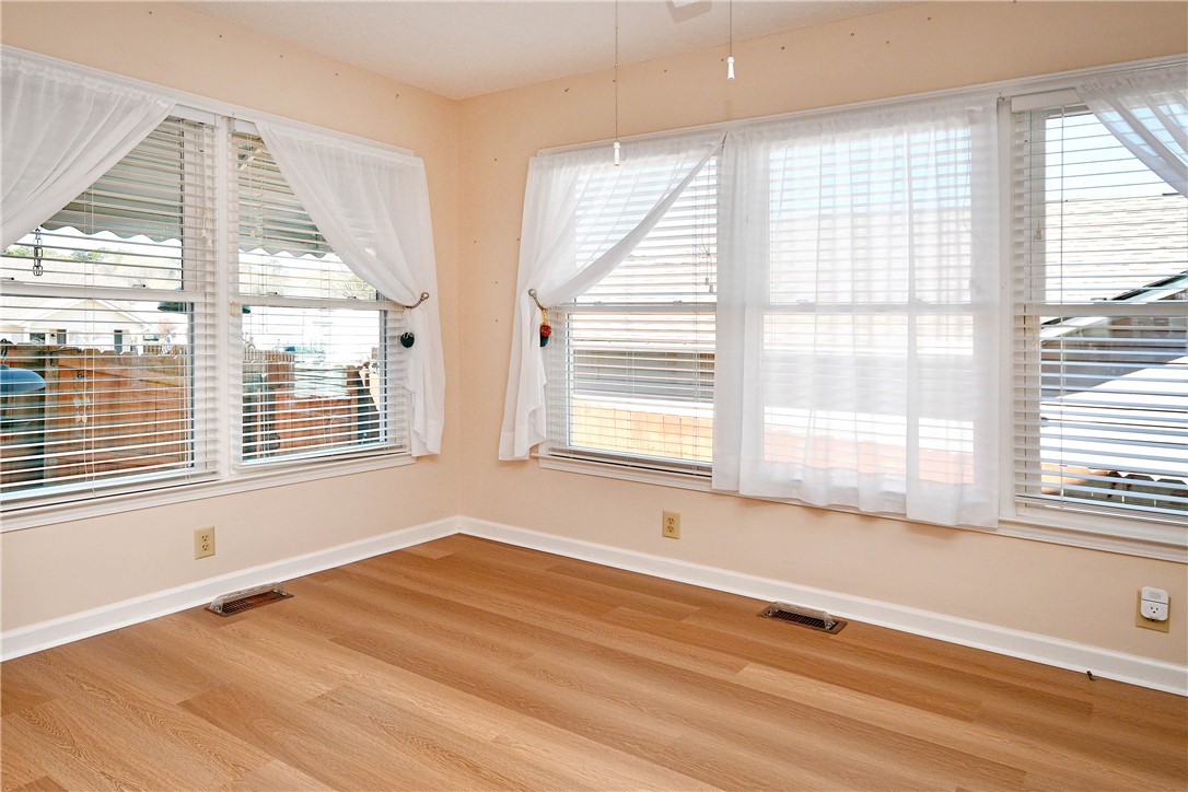 103 Baldwin Place Easley, SC 29642 - Photo 18 of 42 This bright room features wide windows with blinds and durable wood flooring.