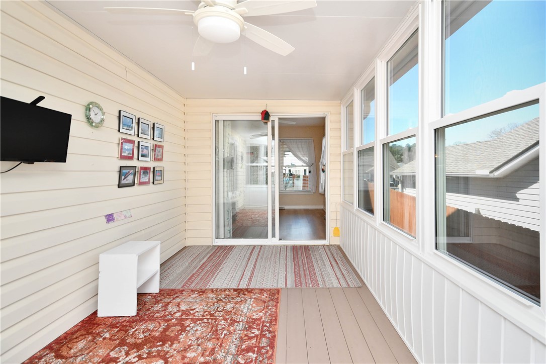 103 Baldwin Place Easley, SC 29642 - Photo 21 of 42 This sunroom offers an inviting retreat, seamlessly blending indoor comfort with outdoor views.