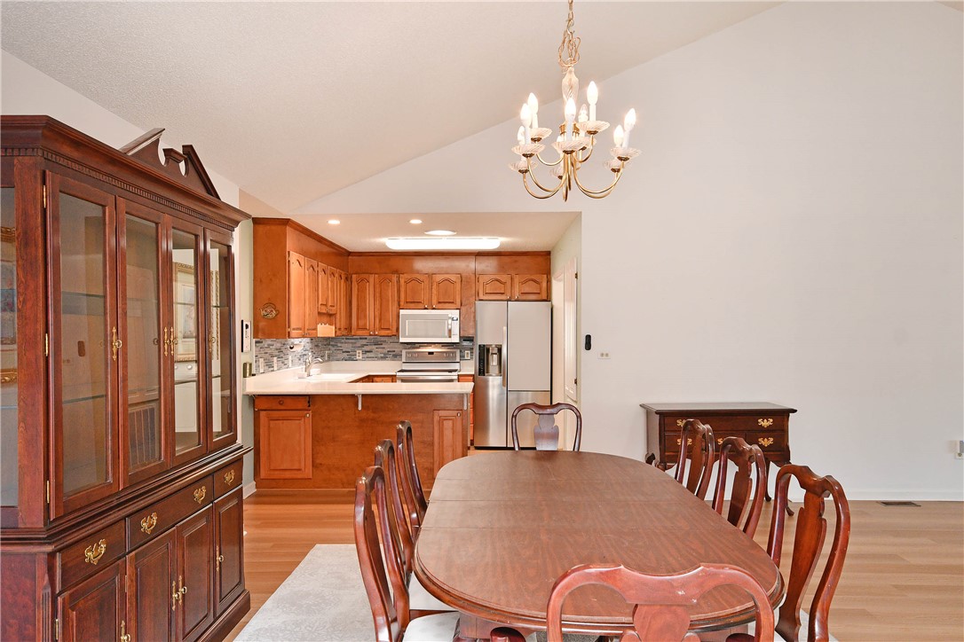103 Baldwin Place Easley, SC 29642 - Photo 22 of 42 This inviting dining area seamlessly connects to a modern kitchen, perfect for entertaining.