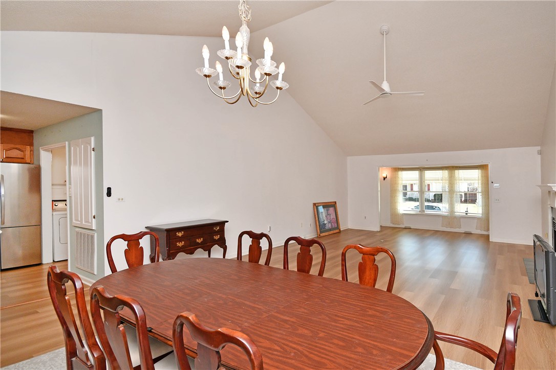 103 Baldwin Place Easley, SC 29642 - Photo 23 of 42 This spacious open-concept dining area features high vaulted ceilings and hardwood flooring.