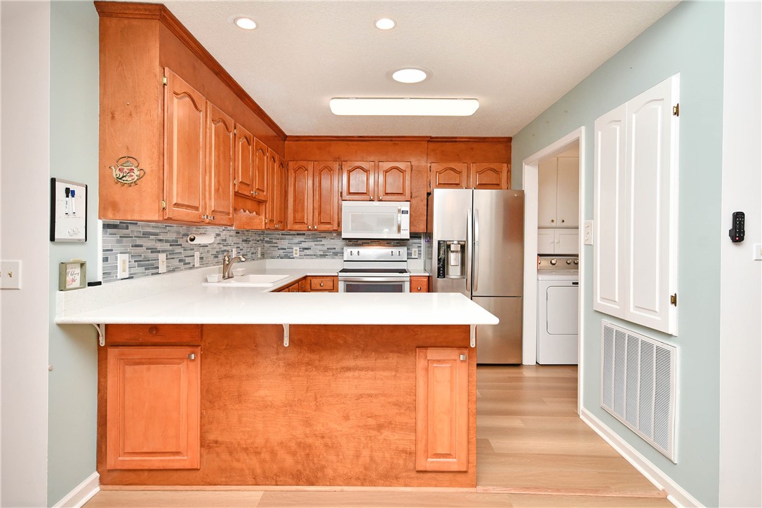 103 Baldwin Place Easley, SC 29642 - Photo 24 of 42 This updated kitchen features ample cabinetry and integrated appliances for modern living.