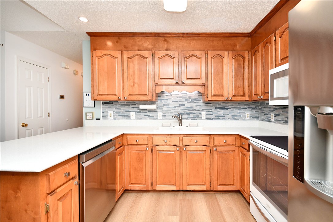 103 Baldwin Place Easley, SC 29642 - Photo 25 of 42 This spacious kitchen offers ample counter space and storage, perfect for culinary endeavors.