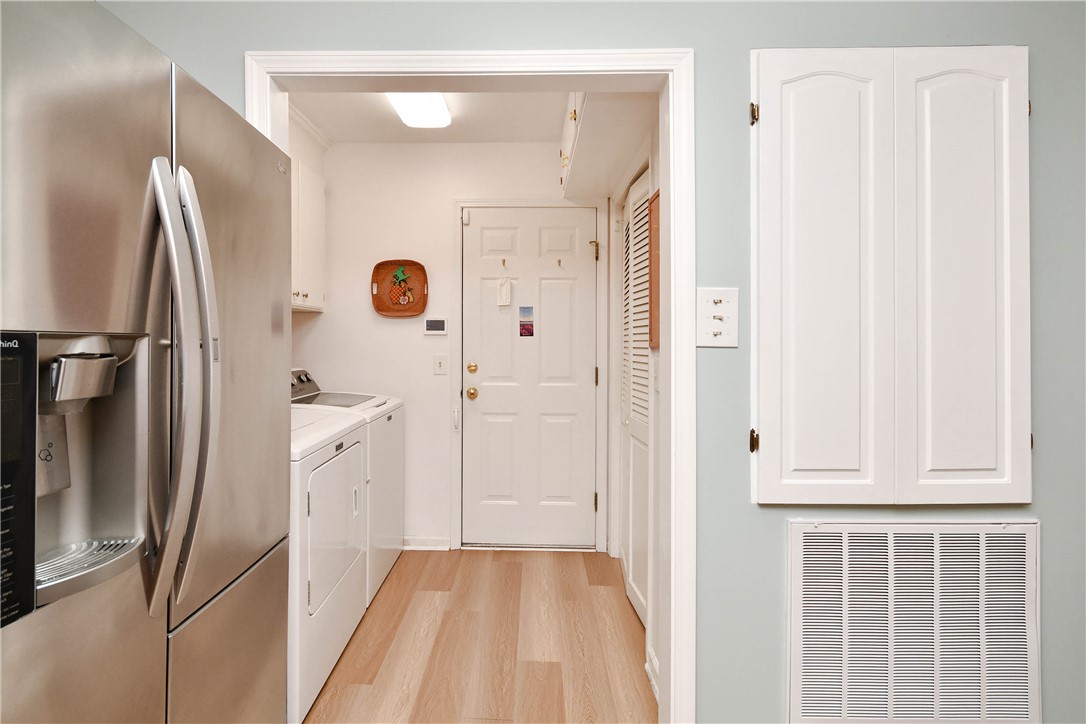 103 Baldwin Place Easley, SC 29642 - Photo 26 of 42 This functional utility space combines laundry convenience with essential appliances, featuring durable flooring.