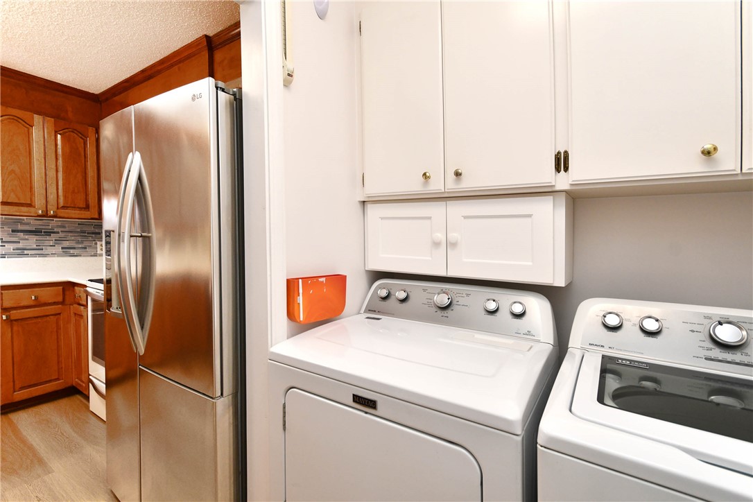 103 Baldwin Place Easley, SC 29642 - Photo 28 of 42 This dedicated laundry space combines functionality with sleek design, making chores effortless.