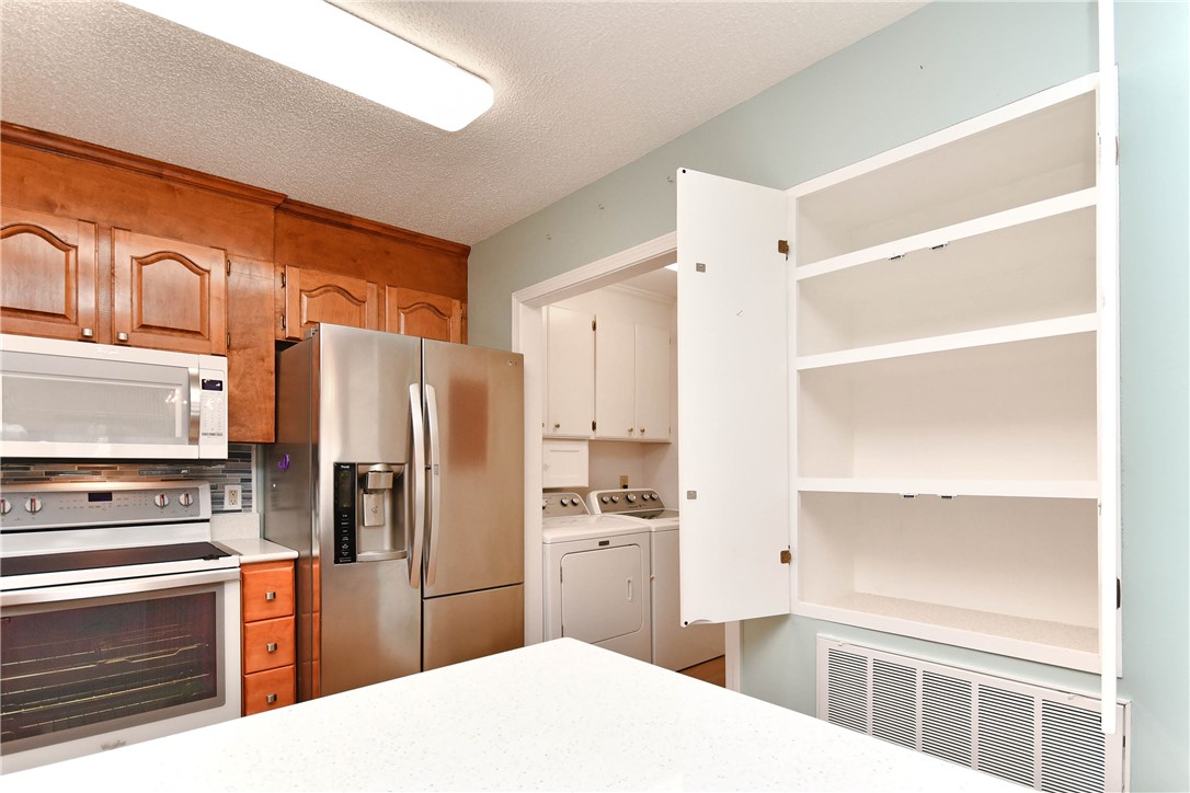 103 Baldwin Place Easley, SC 29642 - Photo 30 of 42 This functional kitchen features stainless steel appliances and abundant cabinetry, offering seamless living.