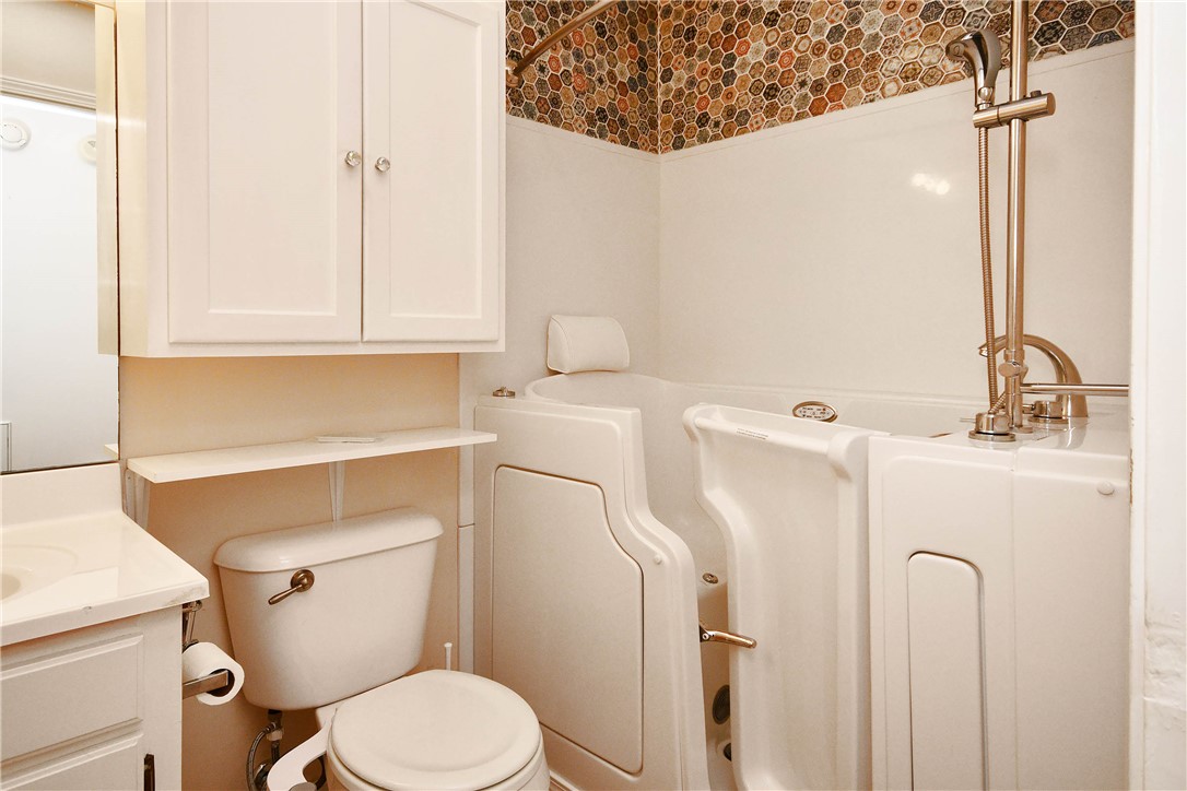 103 Baldwin Place Easley, SC 29642 - Photo 32 of 42 This bathroom features practical design with a walk-in tub, enhancing daily living.