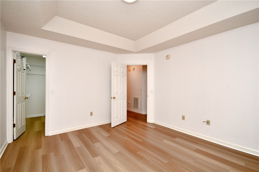 103 Baldwin Place Easley, SC 29642 - Photo 38 of 42 This spacious bedroom features beautiful flooring and a functional layout, offering comfort and style.