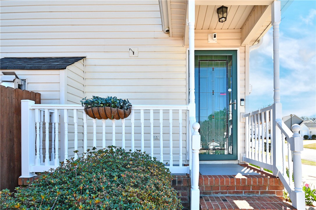 103 Baldwin Place Easley, SC 29642 - Photo 6 of 42 This inviting porch offers a warm welcome to all who enter, providing a charming facade.
