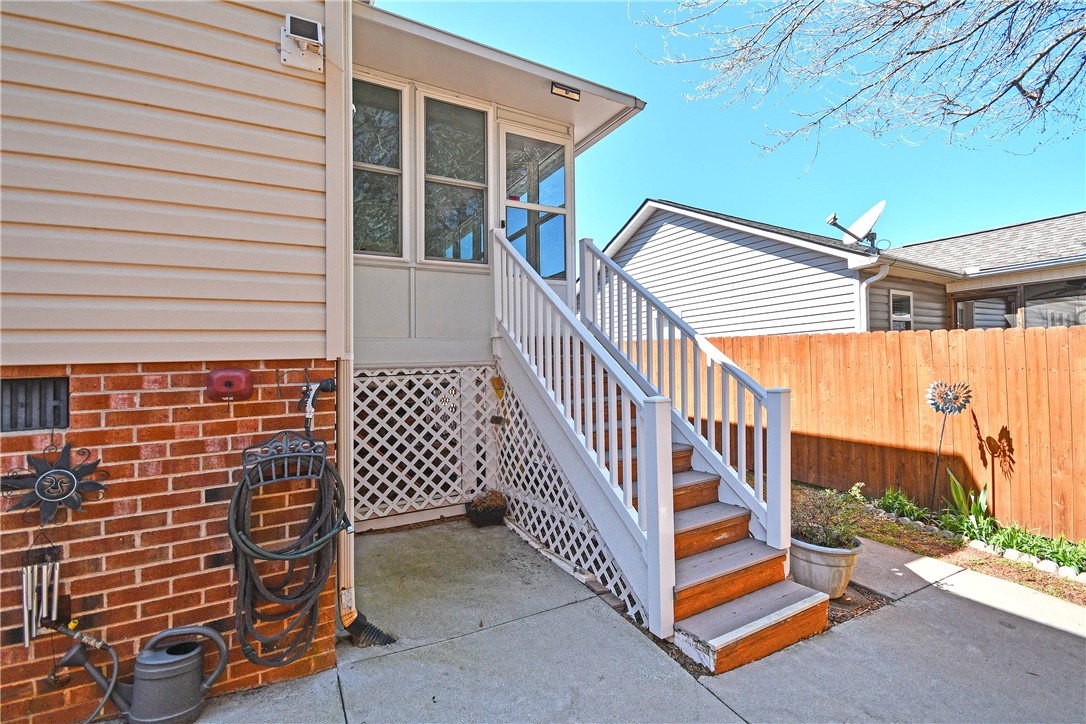 103 Baldwin Place Easley, SC 29642 - Photo 9 of 42 This charming outdoor area offers a blend of brick and siding, featuring a welcoming set of stairs.