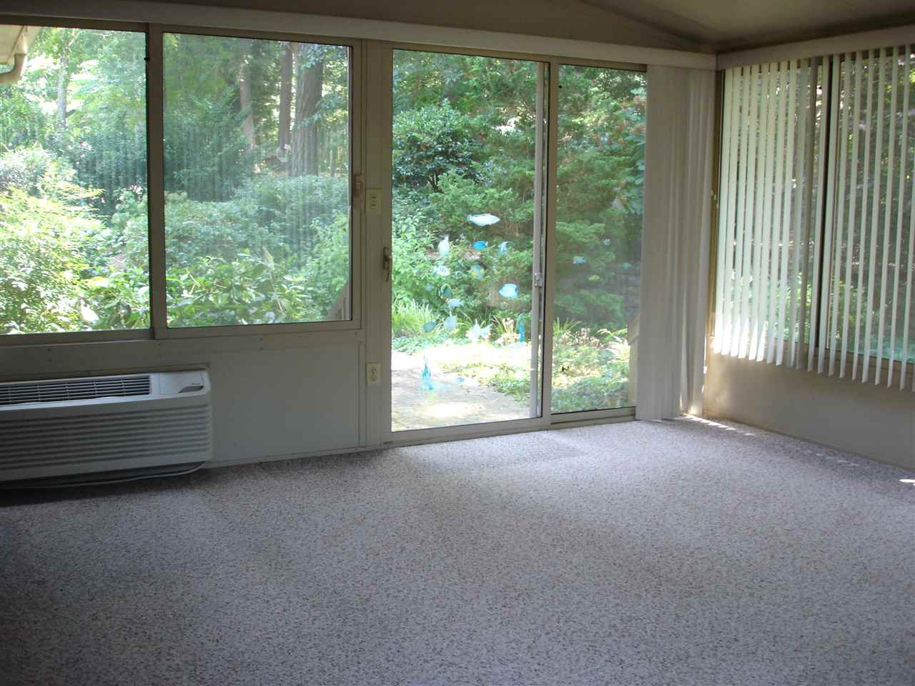 4516 Oak Park Road Raleigh, NC 27612 - Photo 10 of 17 The all-season sun room is heated and cooled; It looks out to the beautifully landscaped back yard Sun Room