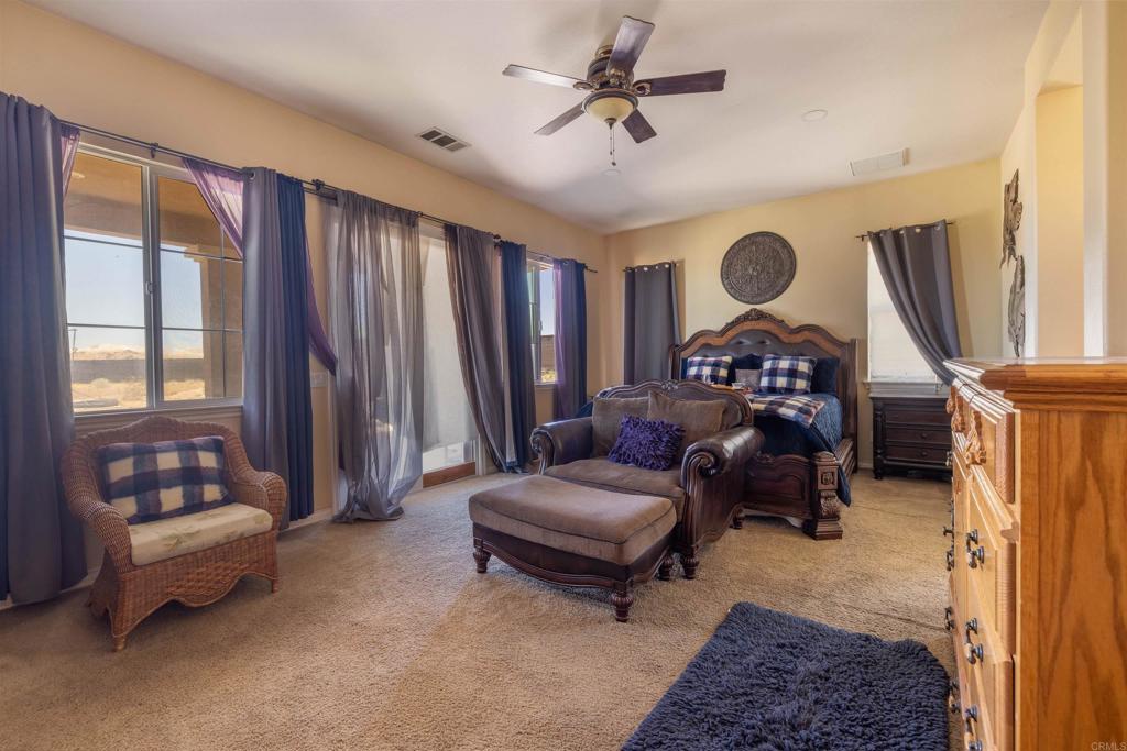 19506 Arcata Road Apple Valley, CA 92307 - Photo 5 of 34 Large primary bedroom designed as a private retreat with plenty of natural light and space.