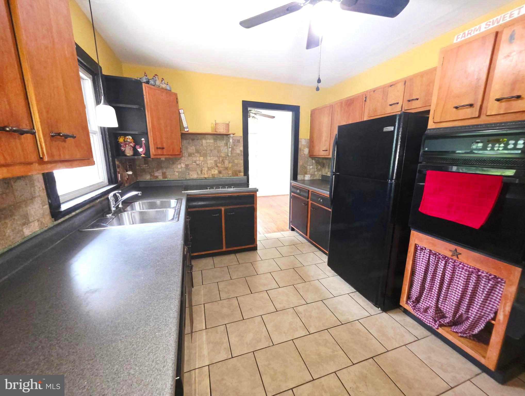 8920 Marshall Corner Road Pomfret, MD 20675 - Photo 12 of 31 a kitchen with stainless steel appliances granite countertop a refrigerator and a stove