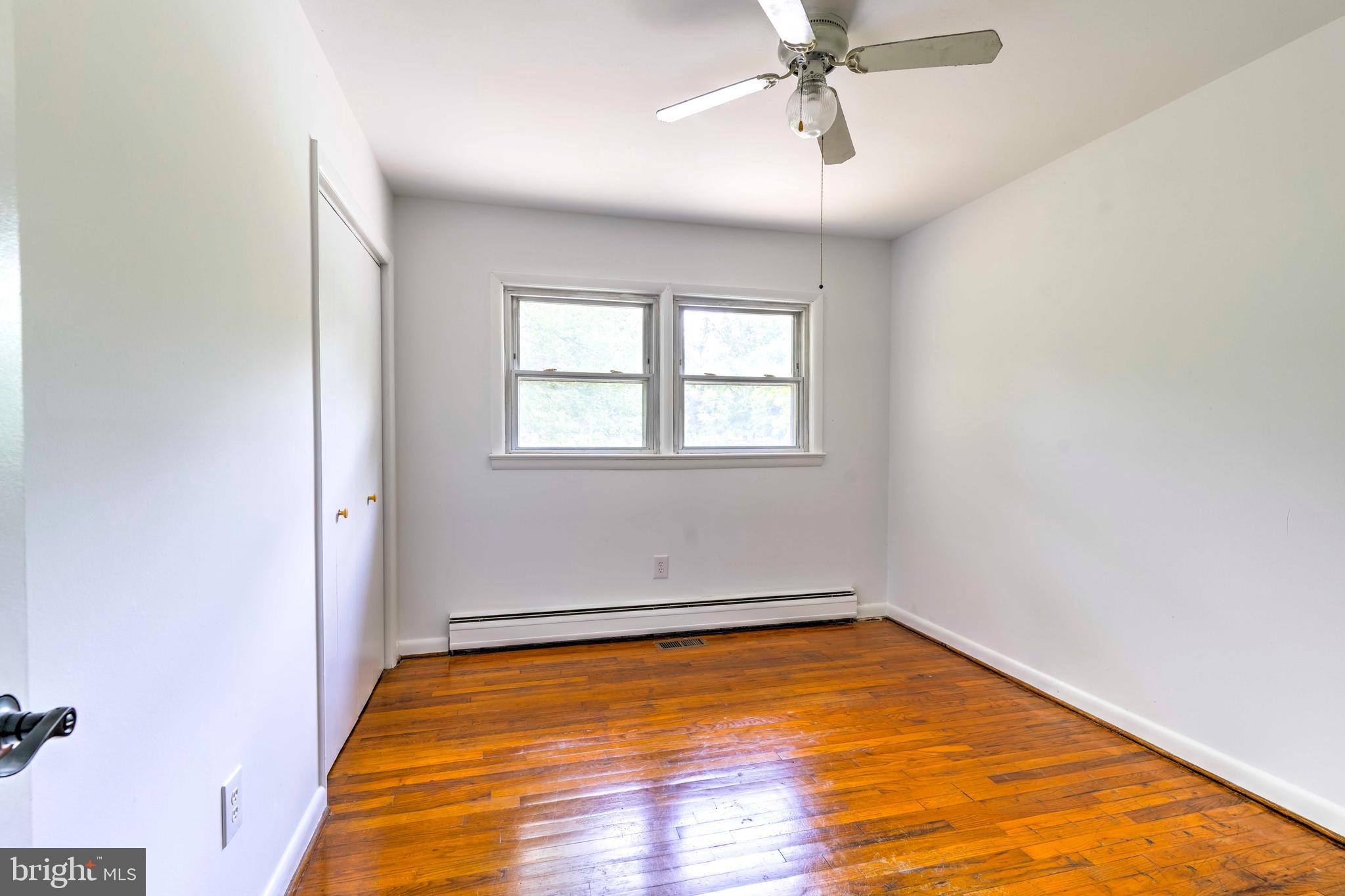 8920 Marshall Corner Road Pomfret, MD 20675 - Photo 18 of 31 an empty room with a window and ceiling fan