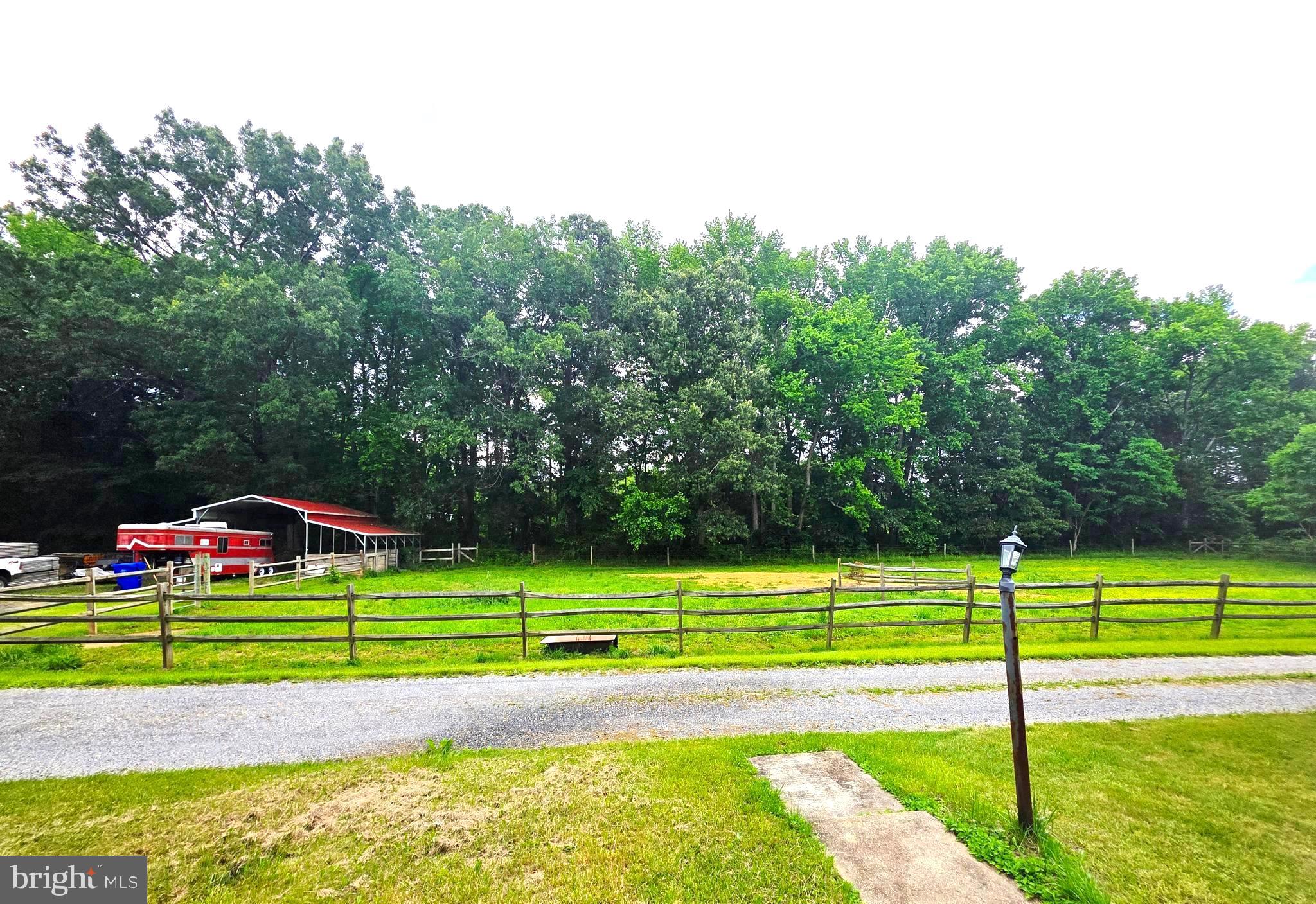 8920 Marshall Corner Road Pomfret, MD 20675 - Photo 26 of 31 a view of a tennis court with a small yard