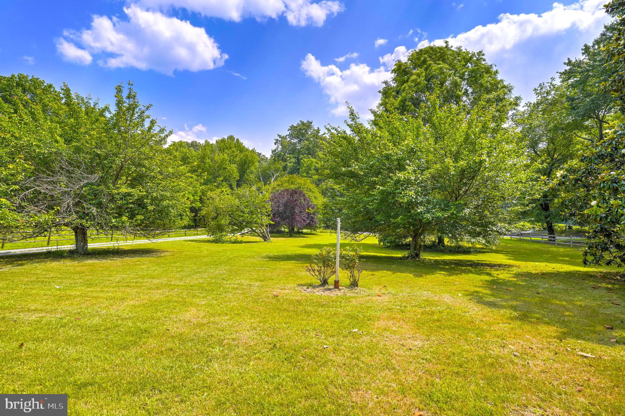 8920 Marshall Corner Road Pomfret, MD 20675 - Photo 4 of 31 a swimming pool with an outdoor space and seating area
