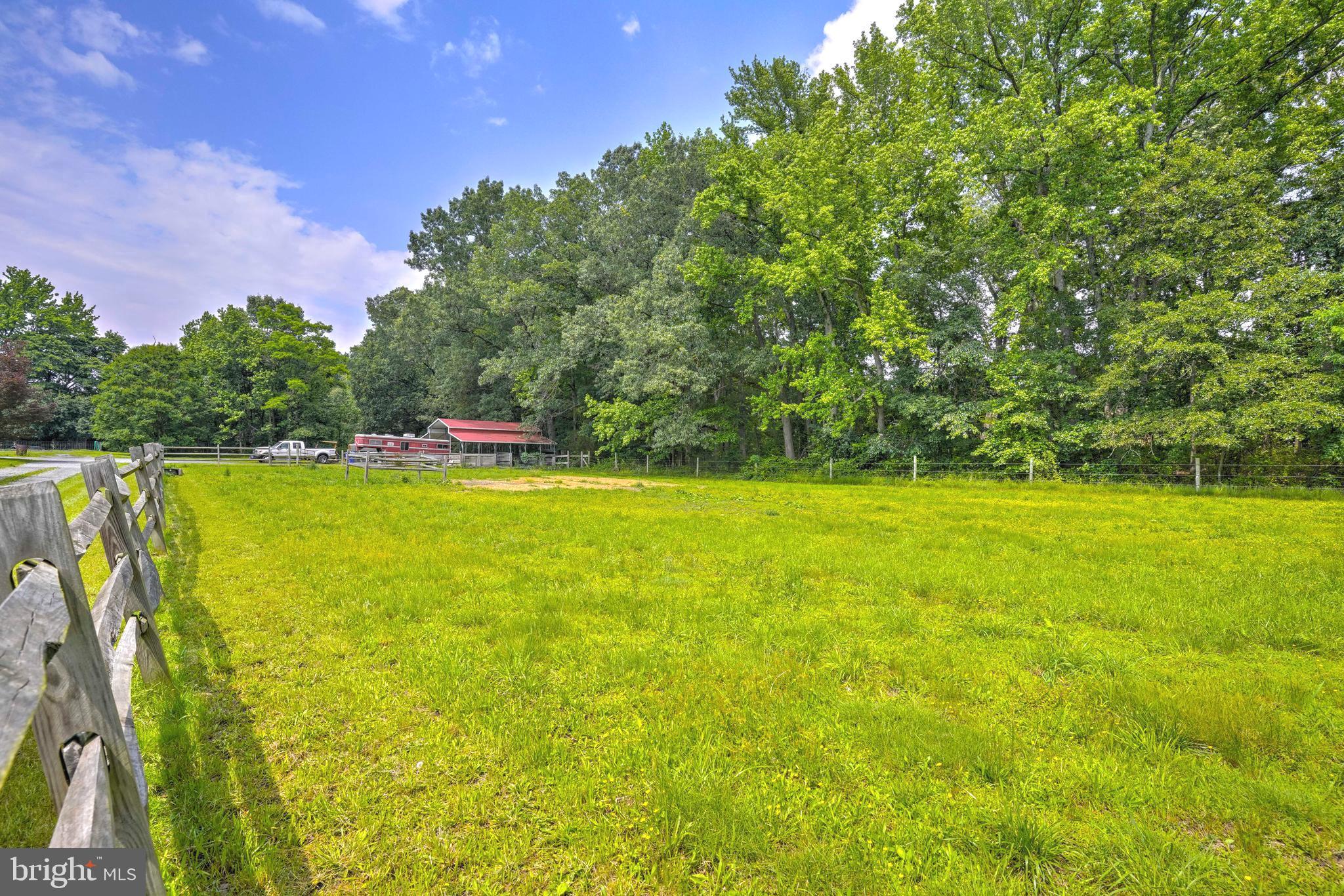 8920 Marshall Corner Road Pomfret, MD 20675 - Photo 5 of 31 a view of outdoor space with swimming pool and green space