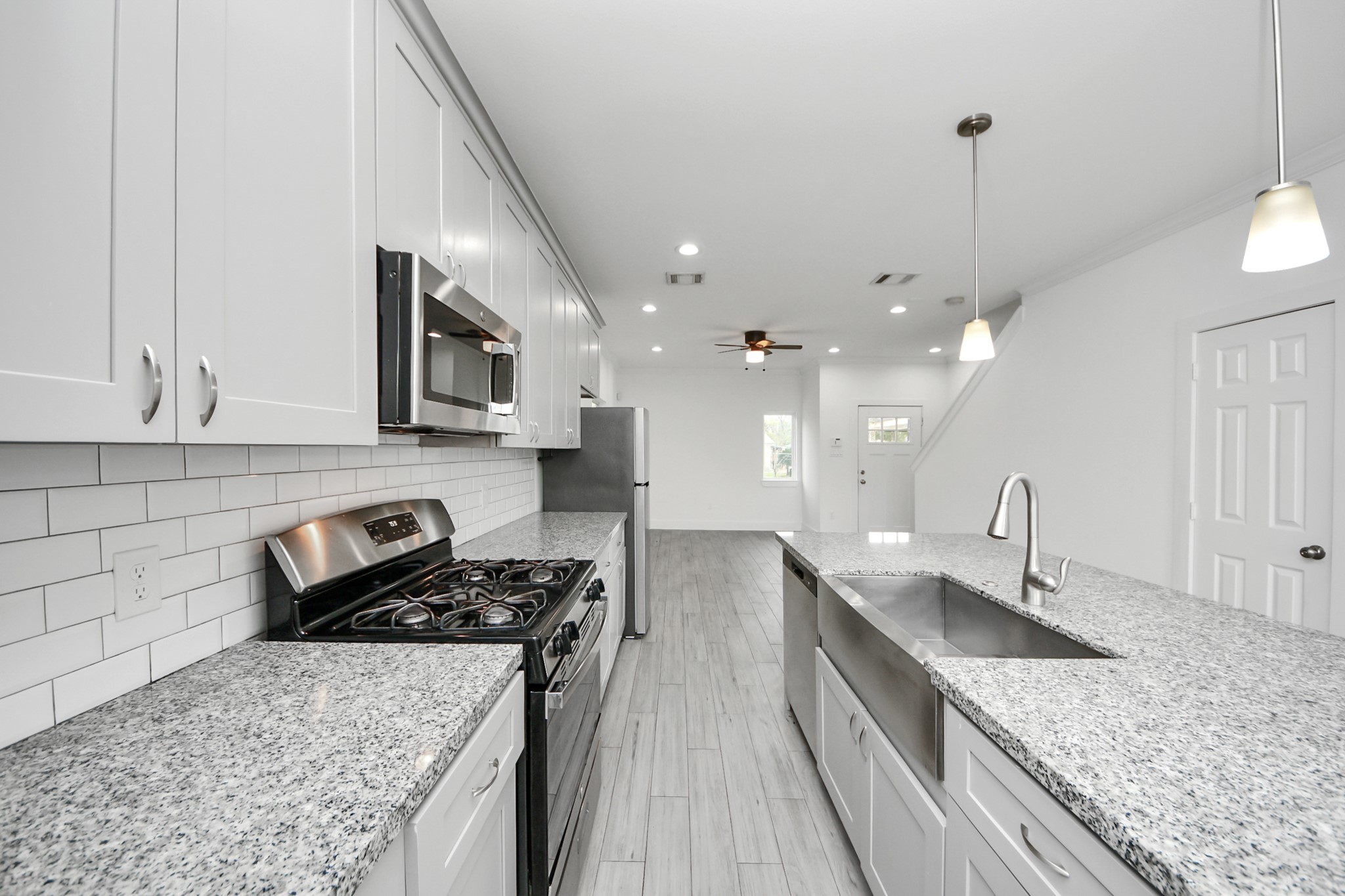 8305 Prairie View Drive, Unit B Houston, TX 77088 - Photo 11 of 22 Deep farmhouse sink and sleek fixtures add style and function to the kitchen