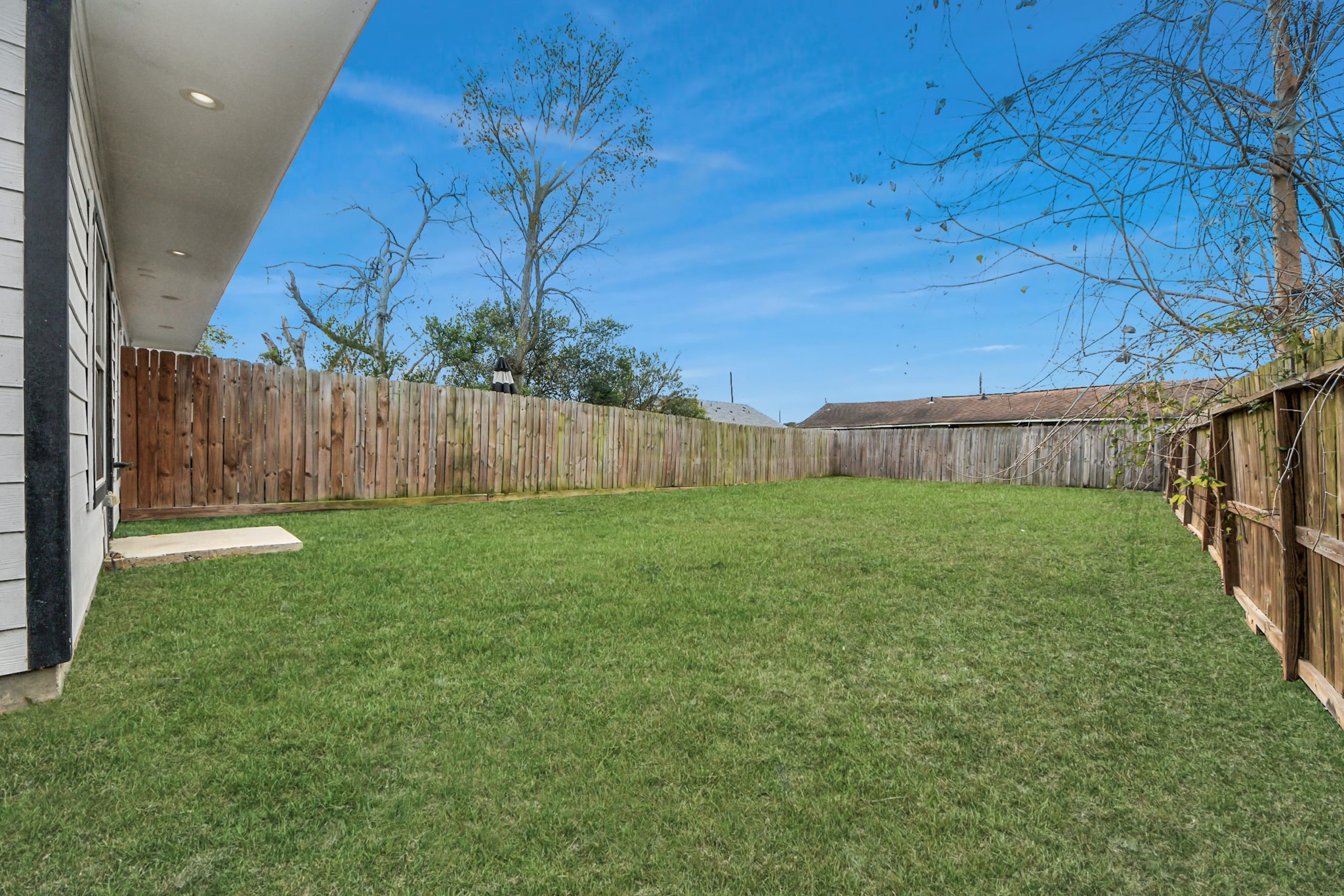 8305 Prairie View Drive, Unit B Houston, TX 77088 - Photo 21 of 22 Spacious fenced backyard, perfect for pets, play, or entertaining outdoors