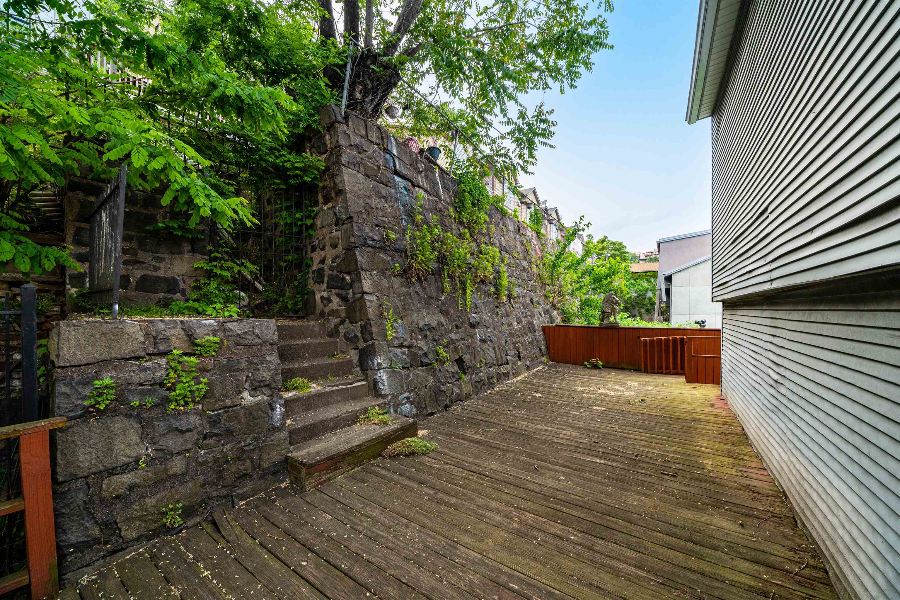 8905 Old River Road, Unit 3 Edgewater, NJ 07047 - Photo 15 of 18 a view of a backyard