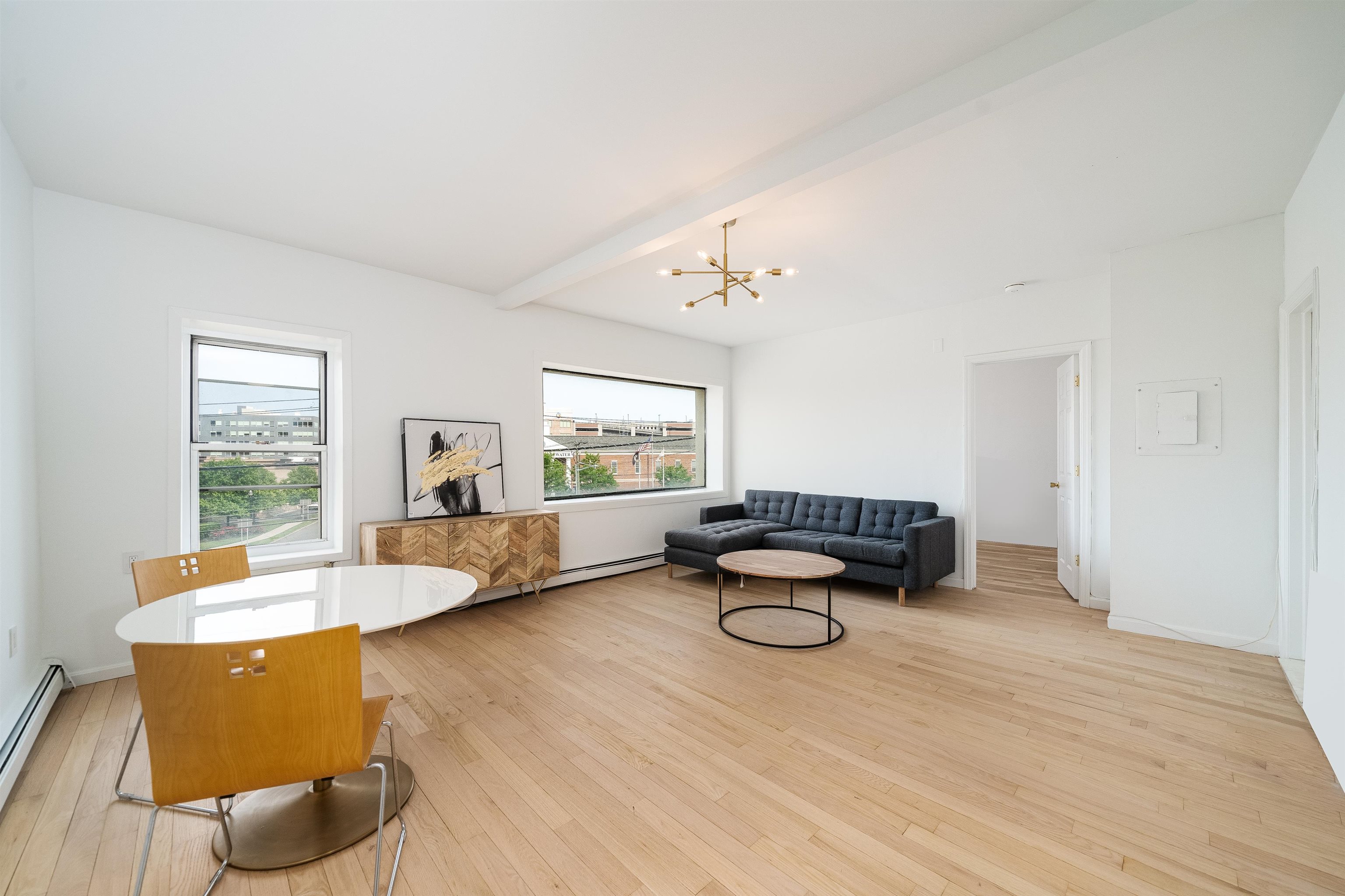 8905 Old River Road, Unit 3 Edgewater, NJ 07047 - Photo 8 of 18 a living room with furniture and a table