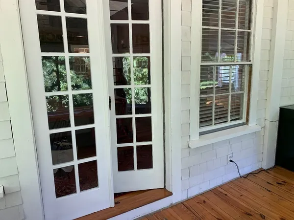 a view of an house with backyard space and patio