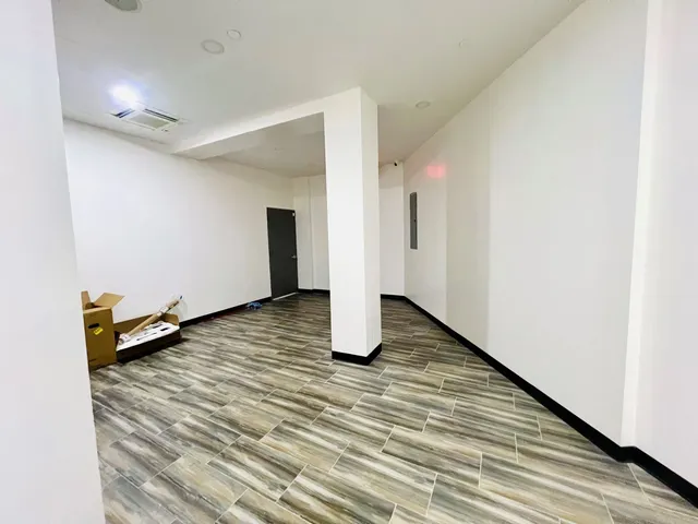 a room with a sink and a mirror