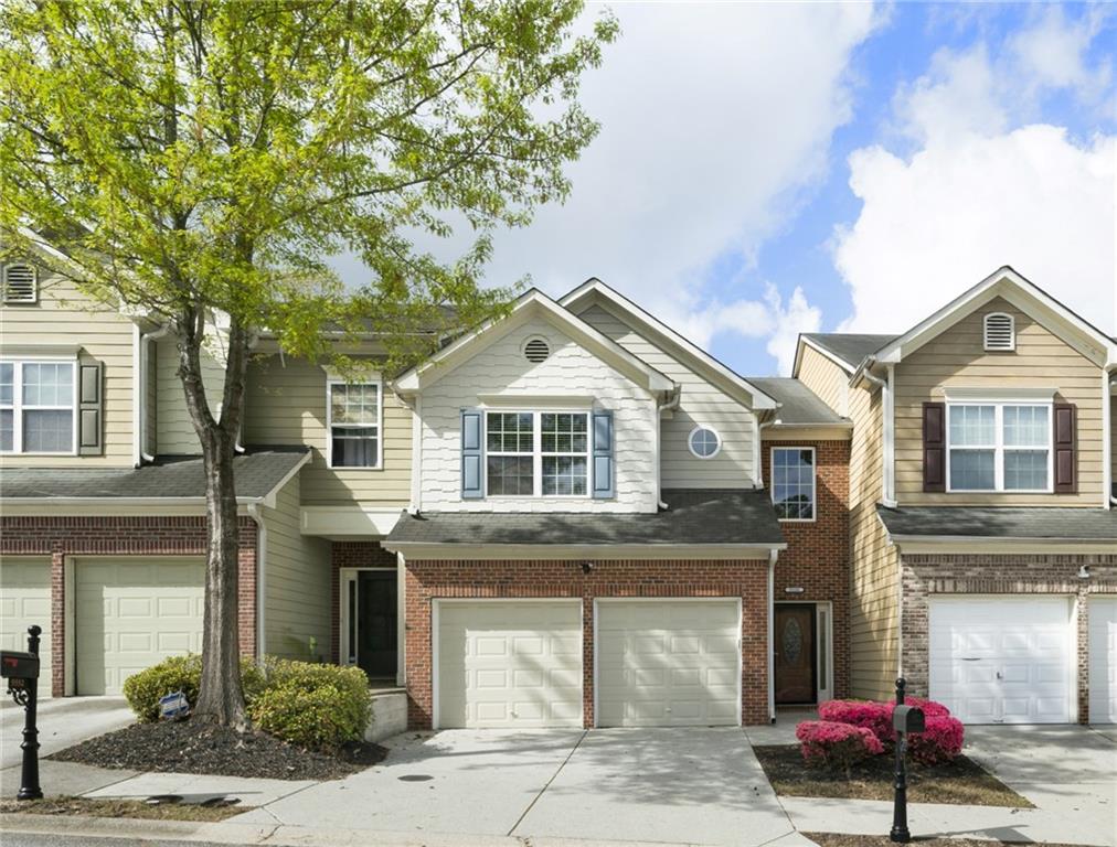 a front view of a house with a garage