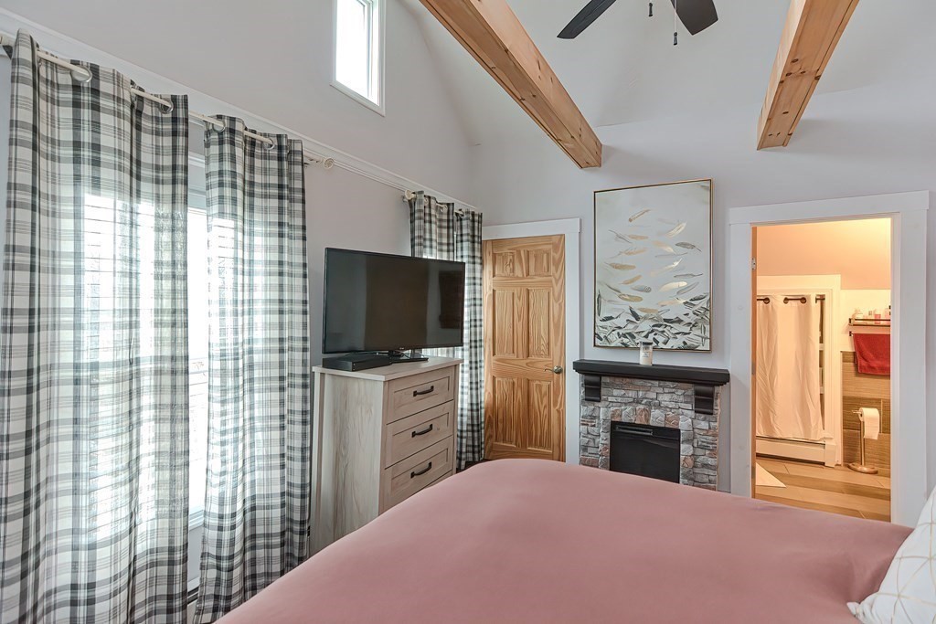 23 Dryden Street Worcester, MA 01605 - Photo 13 of 23 a bedroom with furniture and a flat screen tv