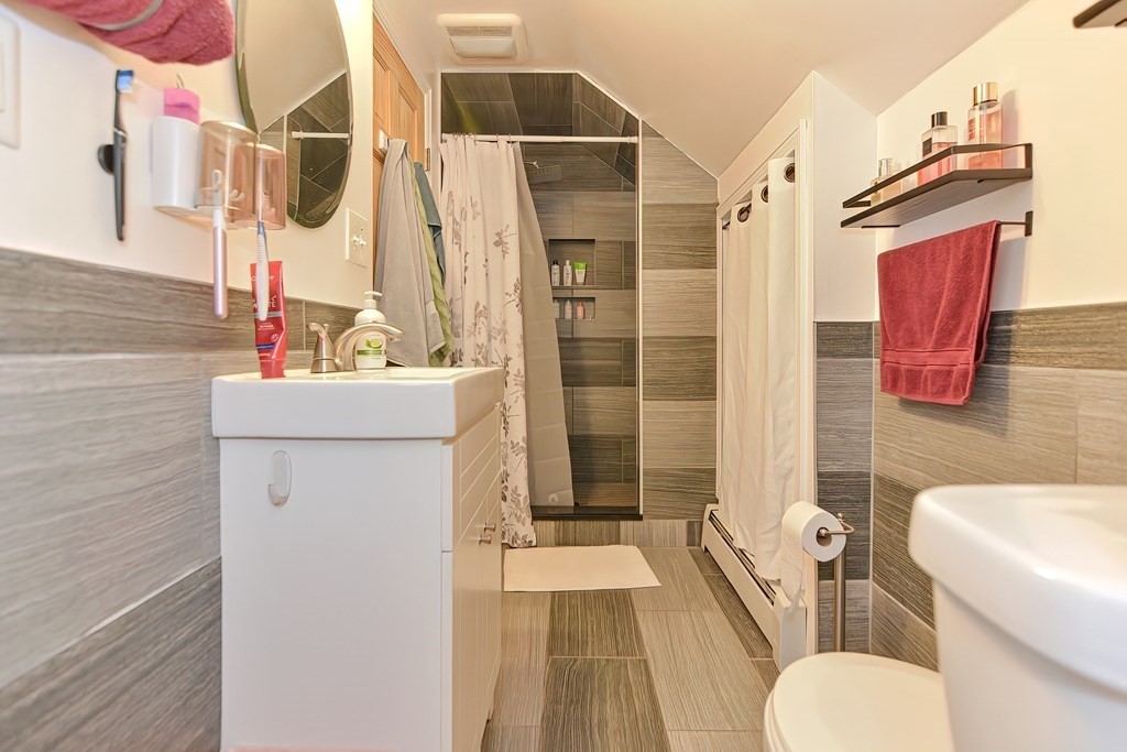 23 Dryden Street Worcester, MA 01605 - Photo 16 of 23 a bathroom with a sink toilet and shower