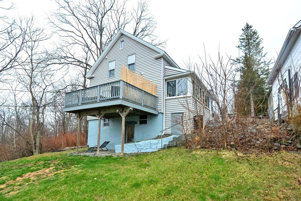 23 Dryden Street Worcester, MA 01605 - Photo 23 of 23 a front view of a house with a yard and garage